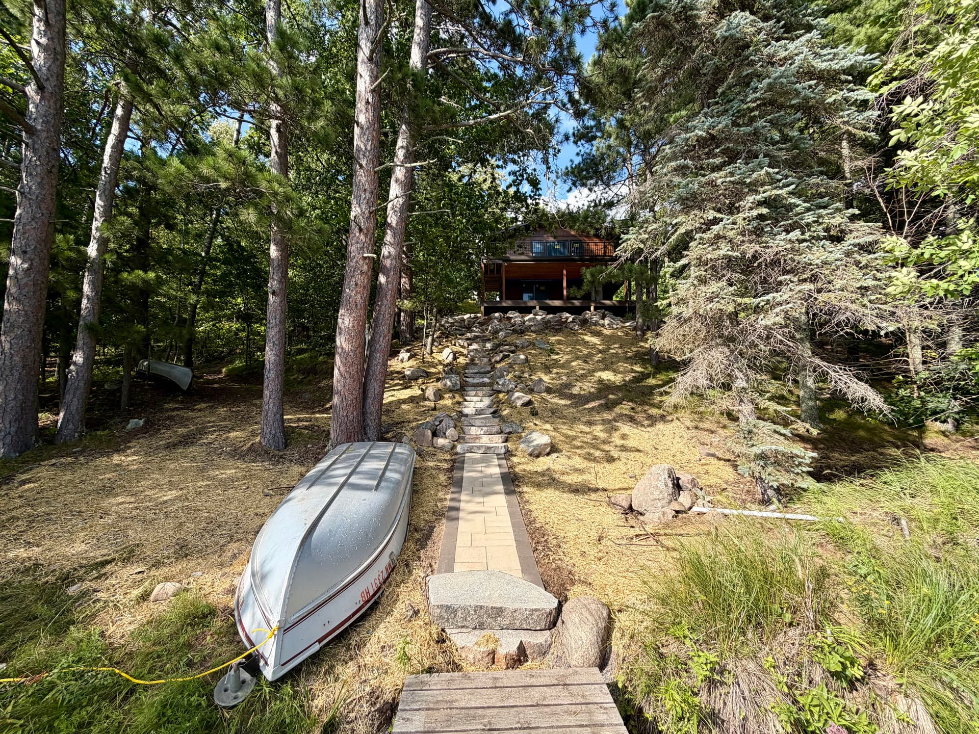 Massive Boulder Retaining Walls and Stone Steps at a Lake Cabin